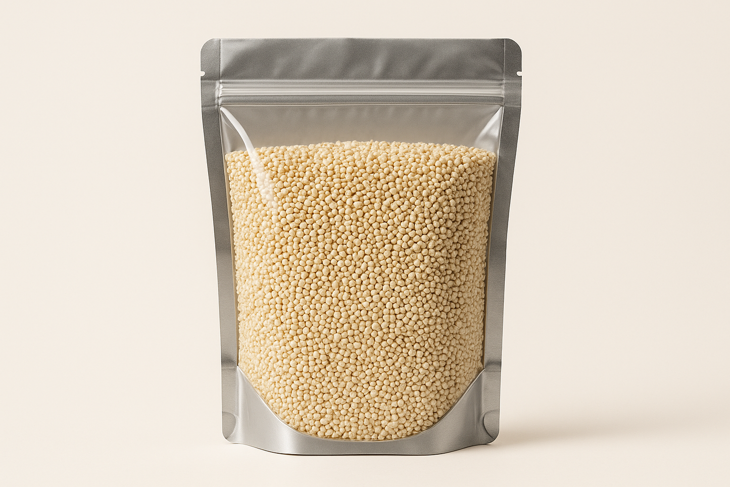 A highly realistic, front-facing product photo of a 1kg stand-up pouch made of aluminum with a fully transparent front from top to bottom, clearly showing the contents inside. The contents should be white quinoa, packed naturally with realistic textures and lighting. The aluminum is only visible on the sides and a small portion at the bottom. The image should have soft, natural shadows and plain background (hex #faf6f1). No text, labels, or branding—just the pouch and its contents.